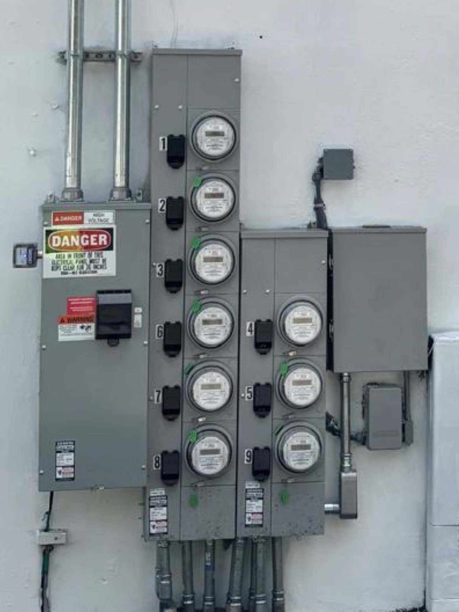 The rebuilt nine-meter bank on a freshly painted white wall, every position numbered and back in service